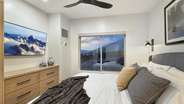 The bedroom boasts a TV and storage for you to unpack and feel at home.