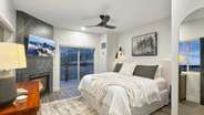 The guest master bedroom in the A suite features a king bed, a fireplace, a private balcony, and an en-suite Jack and Jill bathroom.