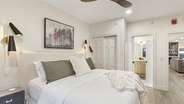 The guest master bedroom features a closet, dresser, gas fireplace, TV, private balcony, and an en-suite Jack and Jill bathroom.