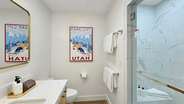 The en-suite bathroom features...