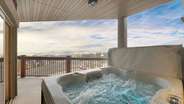 The private hot tub on the private balcony boasts incredible mountain views!