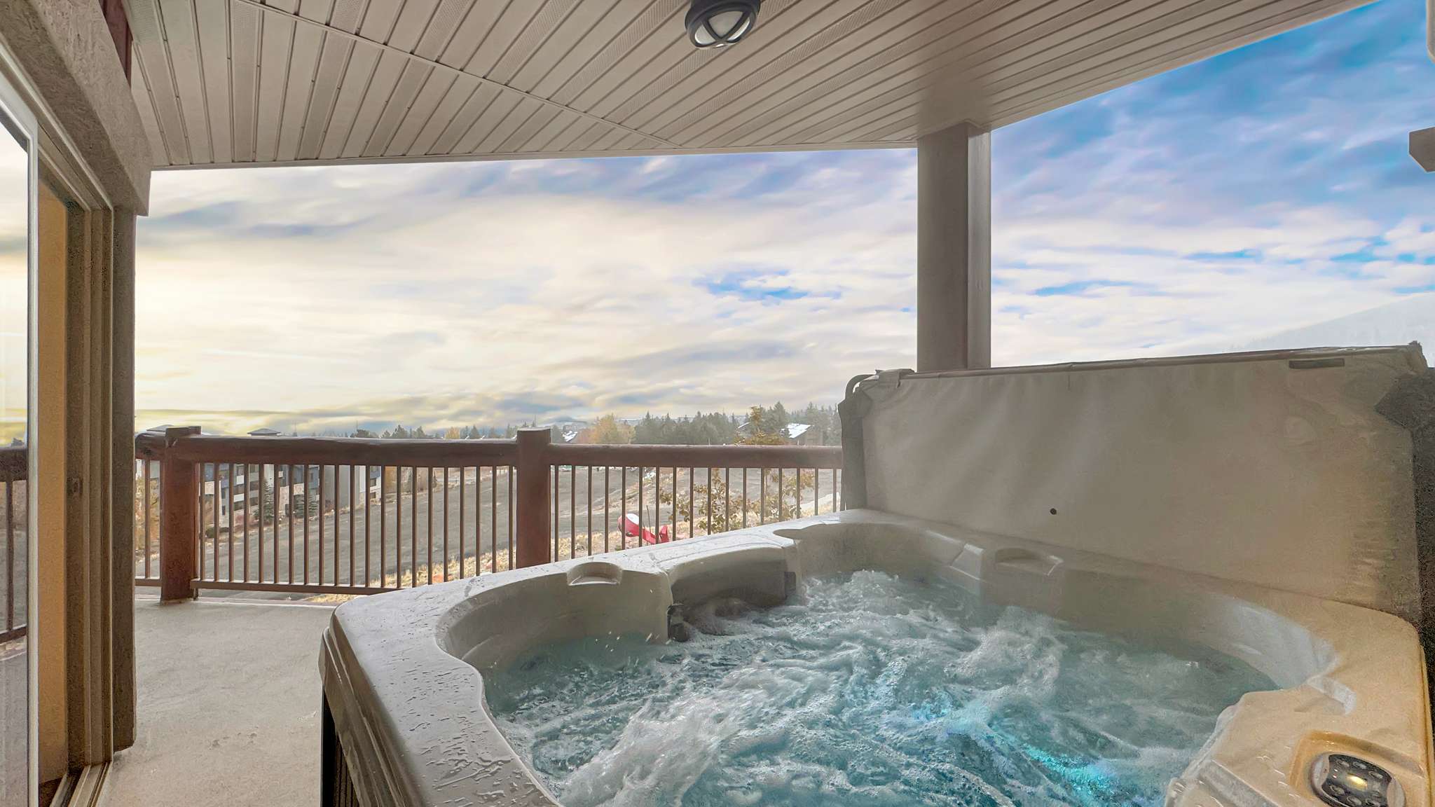 The private hot tub on the private balcony boasts incredible mountain views!