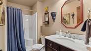 bathroom on main level with a tub
