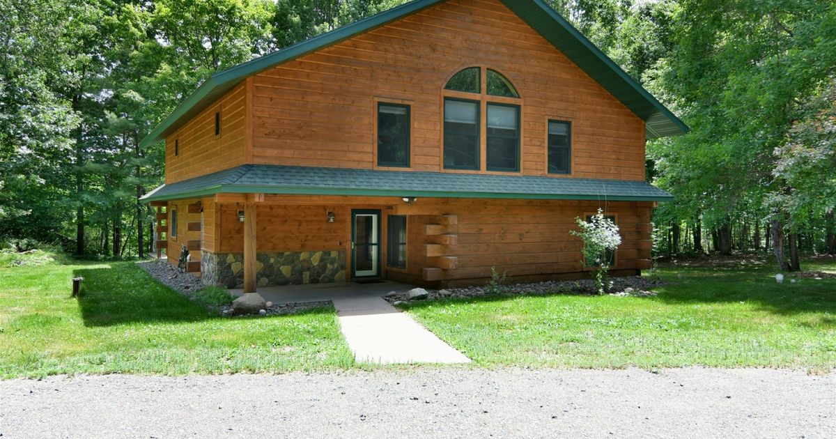 Private log home with waterfall and lake Iron River, WI North Country