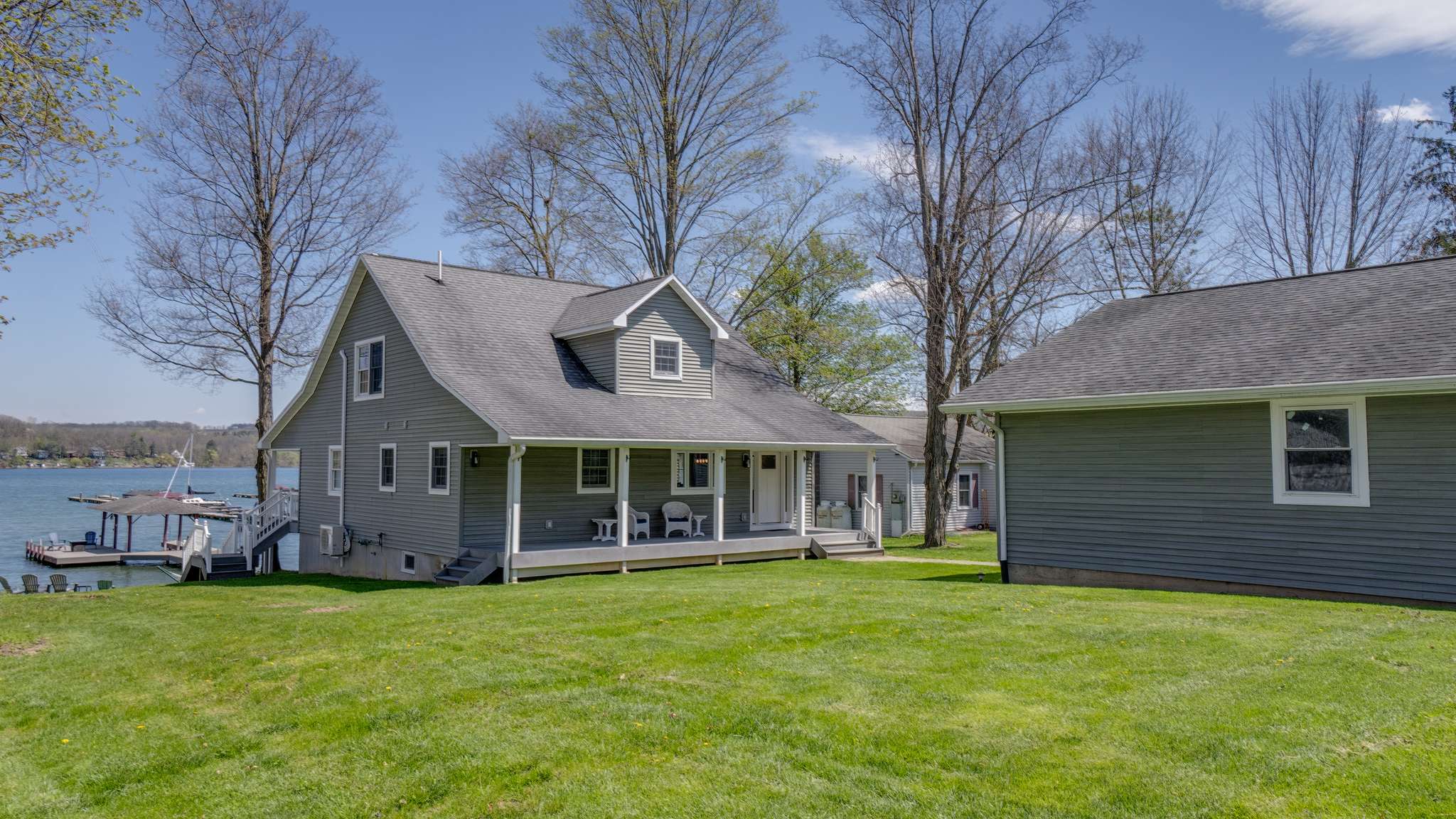 Side yard with garage on the left and the house in background