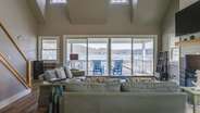 Living room with patio doors to the deck and the lake beyond