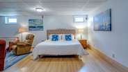 King bed in the lower level family room 