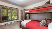 Lower level bunk room with twin/twin and twin/queen bunk beds