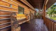 Gorgeous custom woodwork front porch seating