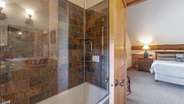 Upstairs king suite with attached bathroom and cigar patio
