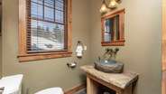 Half bathroom located off the kitchen hallway
