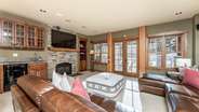 Downstairs living room with wet bar and patio access