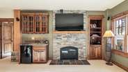 Downstairs living room with wet bar and patio access