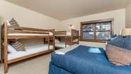 Downstairs queen room with two sets of twin/twin bunks