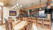 Formal dining area with additional barstool seating for up to 6 guests